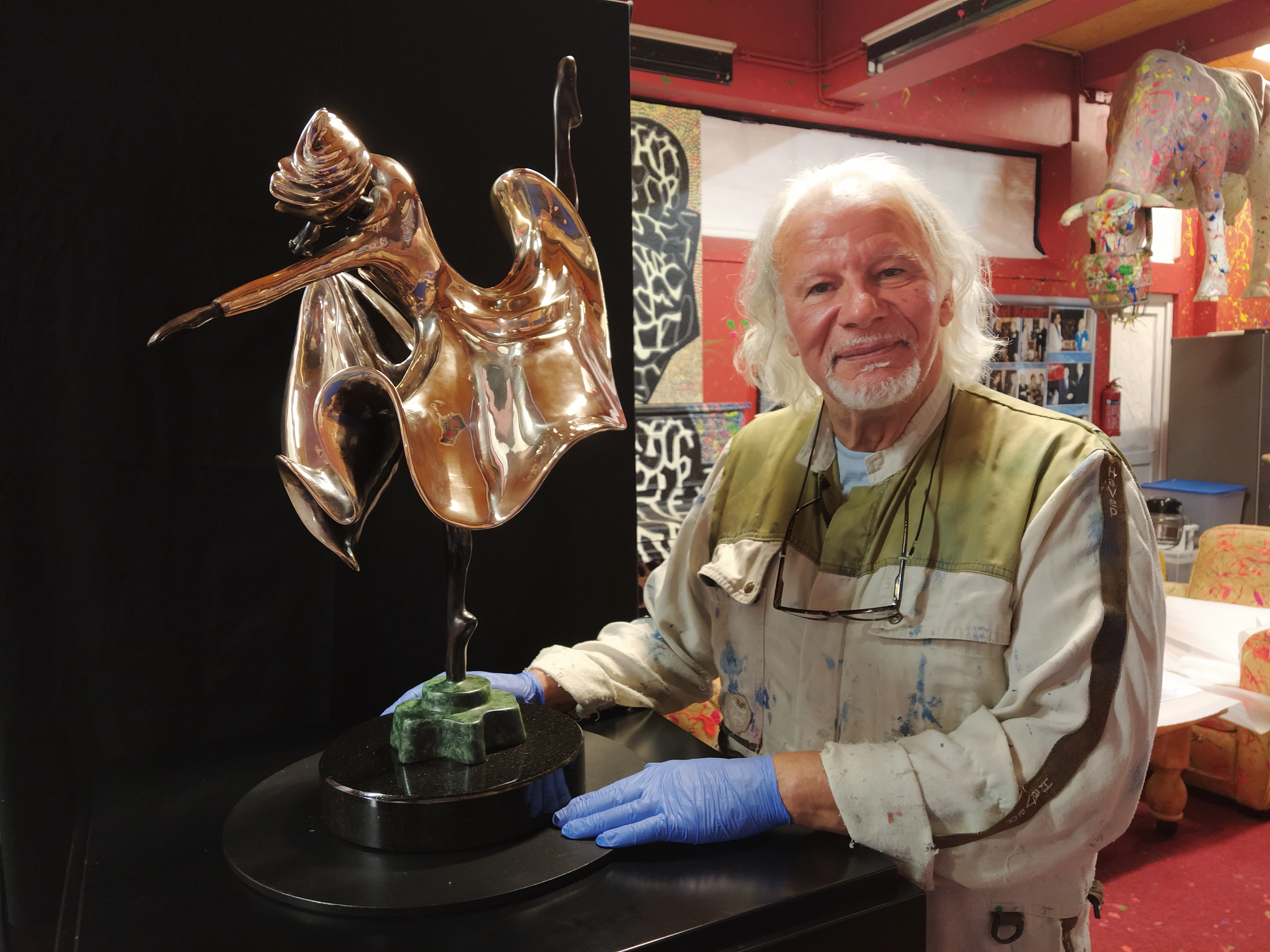 Sculptor and artist Avi Kenan next to his Ballerina "The Perfect Dance" statue 2021